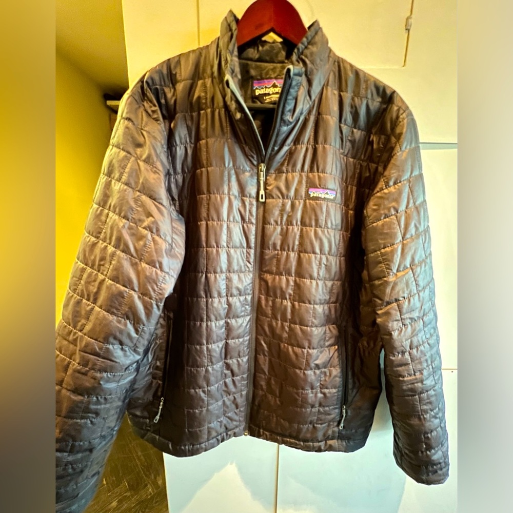 Patagonia jacket in size Large. Thin jacket with proprietary technical filling.